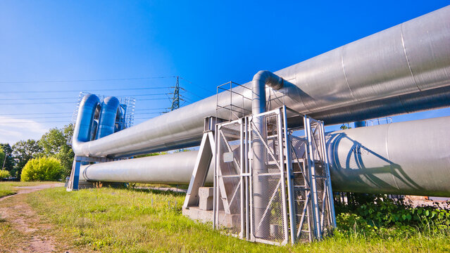 pipeline m pipeline elements close-up, blue sky in the background, green grass in the foreground
