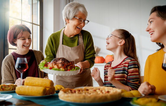Happy Family Gathering Sharing Festive Dinner and Celebrating Together at Home
