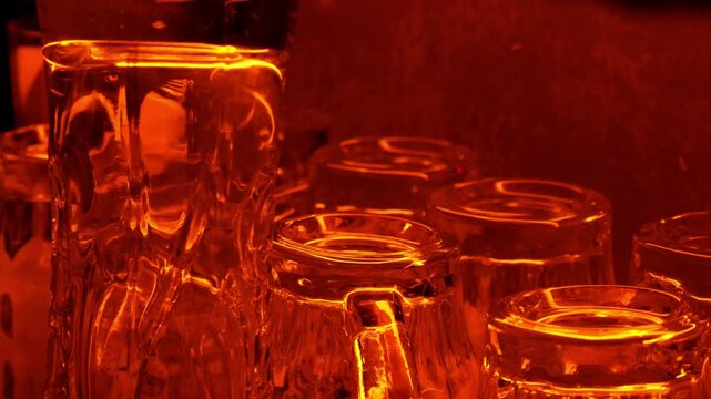 Empty Glassware Rows Bathed in Warm Amber Bar Light, Moody Nightlife Ambiance