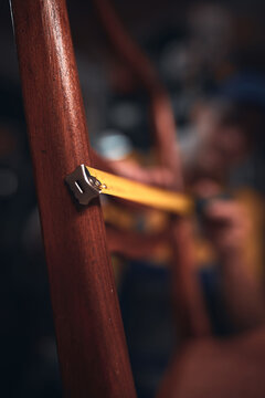 Man working in a workshop for furniture repairing and restoration.