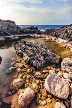 Natural rock pool among stones in Cala d'Or, Mallorca, Spain.