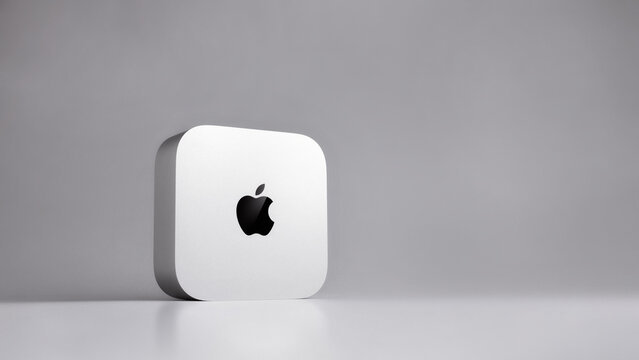 Sumy, Ukraine - September 24, 2026: A new model Apple Mac Mini M6 (2026) computer featuring the Apple Silicon processor standing on light gray surface, modern desktop technology product shot.