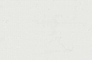 Strands fraying over white textured paper with loose fibers curling above a woven grid, a drawing...