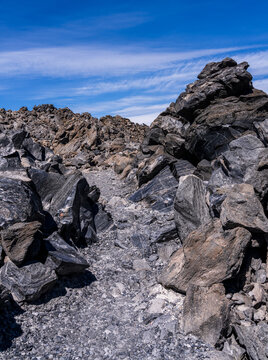 Jagged obsidian lava flow and volcanic rock formations in the Big Obsidian Flow area of Newberry National Volcanic Monument, Deschutes County, Oregon.