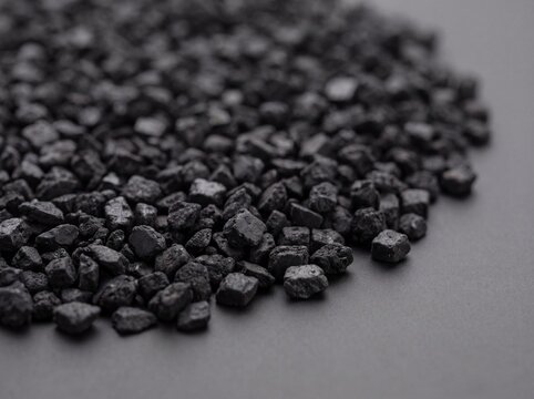 Recycled Rubber Granules and Rubber Crumb Showing Irregular Black Material Texture in Macro Close Up