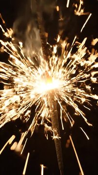 Sparklers Bursting with Golden Light Against a Dark Background, Creating a Festive and Celebratory Motion Graphics Loop.