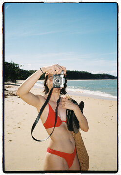 Beach Photographer in Red Bikini