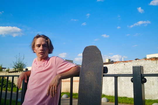 Young Male Skater Portrait Rests Between Training