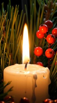 Candles Flickering Gently Amidst Evergreen Branches and Vibrant Red Berries, Creating a Warm, Festive Ambiance.