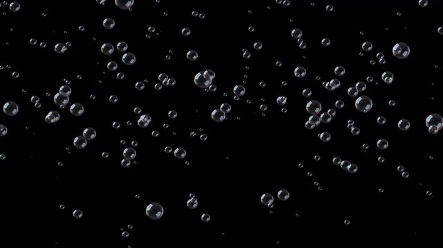 Soap bubbles floating across black background with colorful realistic reflections and glossy glare, downwards movement animation, 4K seamless loop footage for parties, celebrations and compositing