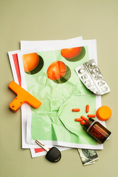 Scattered pills and daily objects on printed photograph of eggs