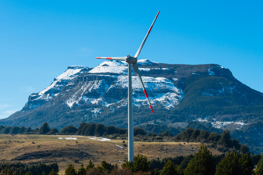 Turbine Below Snowy Mountain