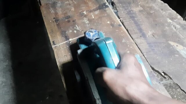 The camera pans across the woodworking equipment and machine tools in the workshop... ...ready to start work.