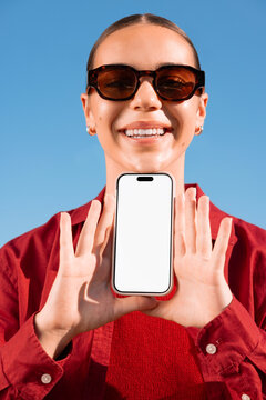 Woman presenting phone mockup with blank screen for app display