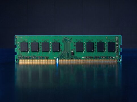 green ram memory module on dark reflective surface