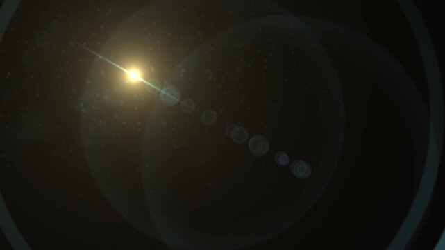 Abstract bright light burst with optical lens flare, Bright explosion of fire and light in a starry night sky with a optical lens flare.