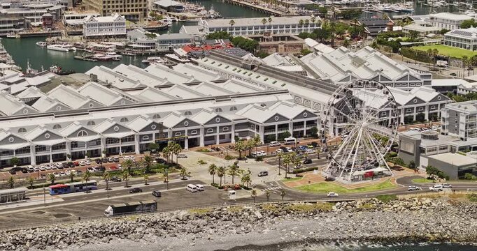 Cape Town South Africa Aerial v50 telephoto birdseye flyover above the shoreline and VA Waterfront toward Downtown, Table Mountain and Signal Hill - Shot with 5k Camera - Jan 11th 2024
