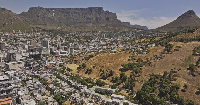 Cape Town South Africa Aerial v60 flyover above Bo-Kaap and De Waterkant toward Downtown, Signal Hill, Lion's Head and Table Mountain - Shot with 5k Camera - Jan 11th 2024