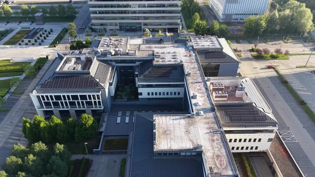 Contemporary business office buildings surrounded by trees aerial perspective