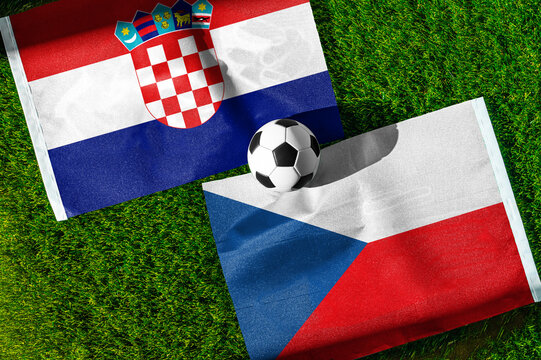 Croatia vs. Czech Republic football match. National flags on green grass with soccer ball in the middle. Football background for international match.