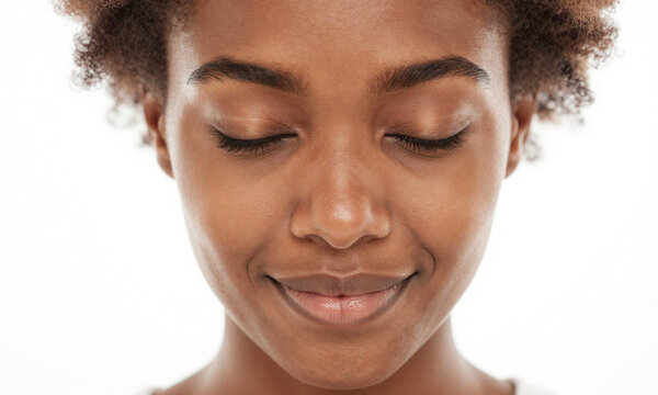 photograph african american woman face chest showcasing closed eyelids soft smile gentle diffused