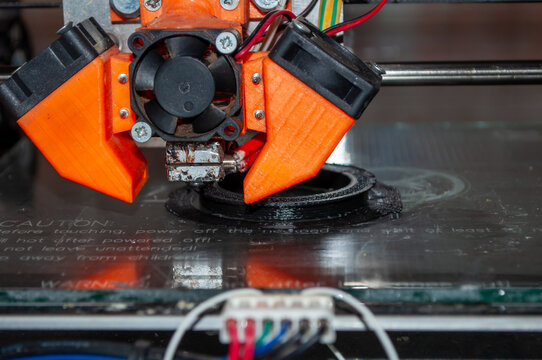 Macro Close-up of 3D Printer Nozzle Extruding Hot Filament
