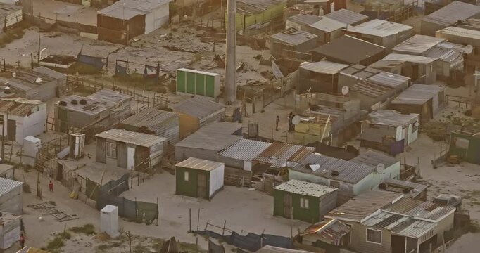 Cape Town South Africa Aerial v108 zoomed low tracking birds eye view, flyover Khayelitsha township slum capturing households living in informal dwellings - Shot with 5k Camera - Jan 11th 2024