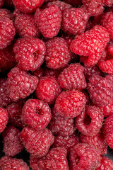 Fresh red raspberries filling frame macro view © Victoria Kondysenko