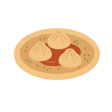 Three dumplings in sauce with green garnish