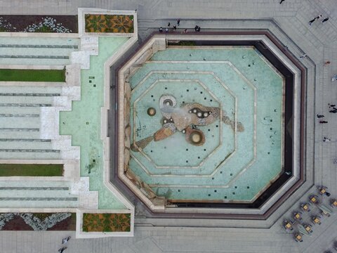 Aerial view of the NDK square fountain with its distinctive octagonal design and water features surrounded by stone paving and outdoor seating in Sofia, Sofia City Province, Bulgaria.