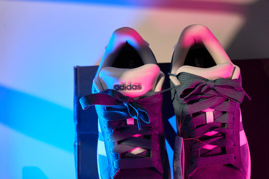 Tyumen, Russia-March 20, 2026: Adidas grand court alpha 0 shoes shown in bold colors with soft background lighting and a box
