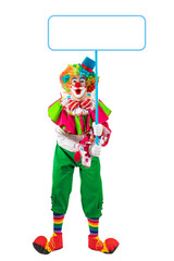 Funny clown holding sign blank template mock up for advertising, posters, greetings, invitations. Entertainer as Joker in a suit and wig, with clown whiteface makeup. © TSViPhoto