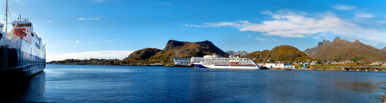 Panoramic view across Svolvaer harbor with cruise ship and car ferry. Travel and maritime scenery in the Lofoten Islands