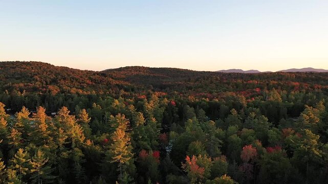Sunset in early fall over Fish Creek Bay NY Adirondacks aerial drone panning East.