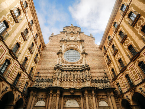 Low angle view of the ornate basilica facade at Montserrat Monastery, Catalonia, Spain