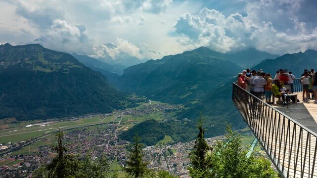 Scenic Interlaken Valley Timelapse with Rushing Clouds over the Bernese Alps and Harder Kulm Viewing Platform in Daylight