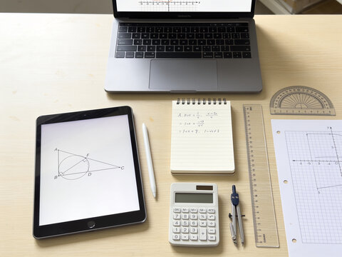 Photorealistic Mathematics Study Desk with Laptop, Geometry Tools, and Copy Space