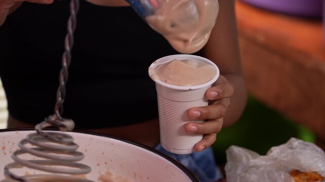 Foamy Egg Ponche Poured Into Cup