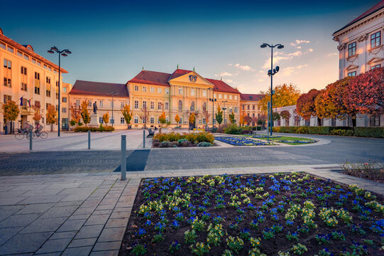 Colorful evening view of County government office - Megyehaza. Breathtaking autumn sunset in Hungary, Europe. Exciting cityscape of Szombathely town. Traveling concept background.