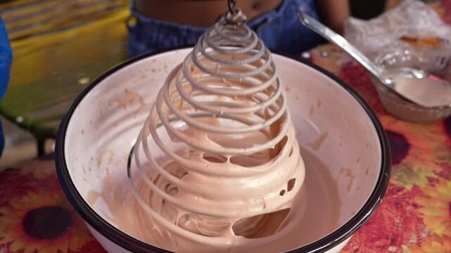 Foamy Peruvian Ponche Prepared With Whisk