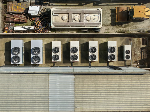 Kilsyth, Australia - 20 September 2026: Aerial view of industrial rooftop featuring multiple HVAC units, machinery, and equipment in an industrial zone.