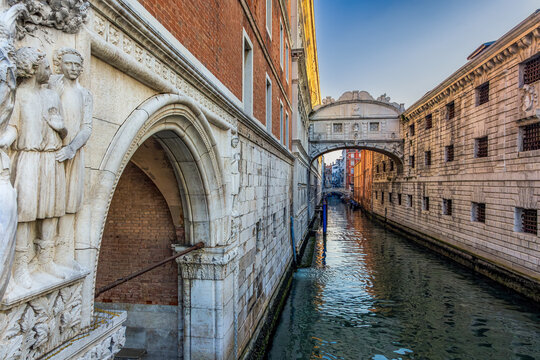 VENICE, ITALY - JUNE 19, 2026: Historic Bridge of Sighs over a narrow canal between Doge's Palace and prison with marble sculpture. 