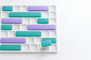Fototapeta premium Top-down view of a staff scheduling grid with teal and lilac shift blocks sliding into place