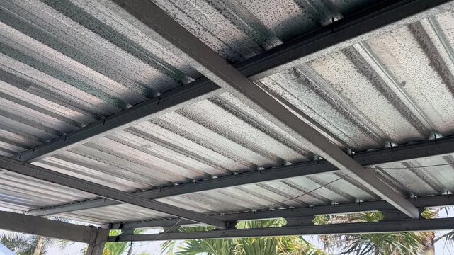 Diagonal View of Corrugated Metal Roof with Steel Beam