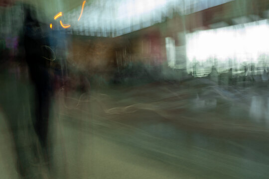 Abstract effect in airport with people created by motion blur while walking
