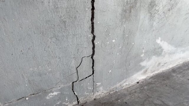 Abstract macro texture of fractured cement concrete wall background