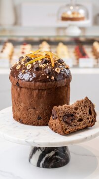 Gourmet Tall Dark Chocolate Panettone with Rocher Glaze and Candied Lemon Zest on Marble