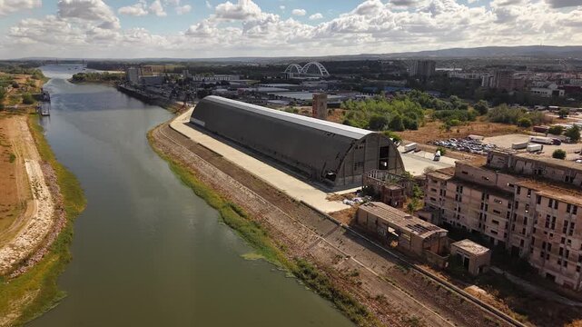 Aerial view of abandoned industrial building beside canal