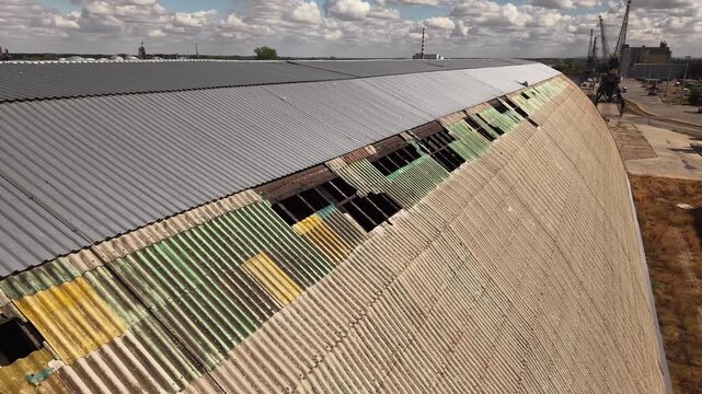 Top down aerial view of weathered metal roof panels