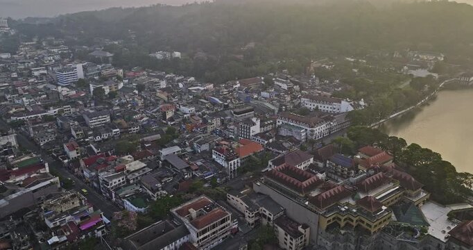 Kandy Sri Lanka Aerial v22 birds eye view drone flyover city centre shopping capturing downtown cityscape, Bogambara Lake and hillside landscape at sunrise - Shot with Mavic 3 Cine - April 2023